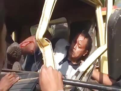 two people pressed inside their car after a strong shock being rescued