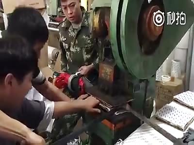 Worker`s fingers flattened by the machine