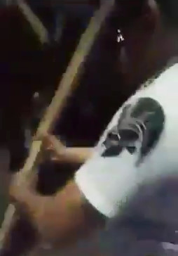 Man caught stealing gets beaten hard with a stick