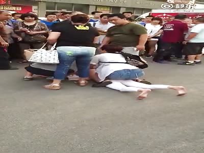 Chinese mistress stripped naked on street