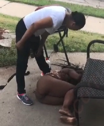 Wife beats naked mistress 