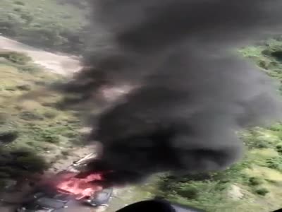 Mexican Navy helicopter Smokes a cartel convoy with Minigun.
