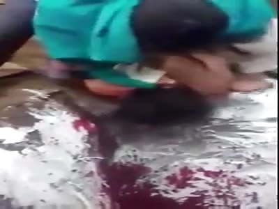 execution of a man who makes a horrible noise when they cut his throat