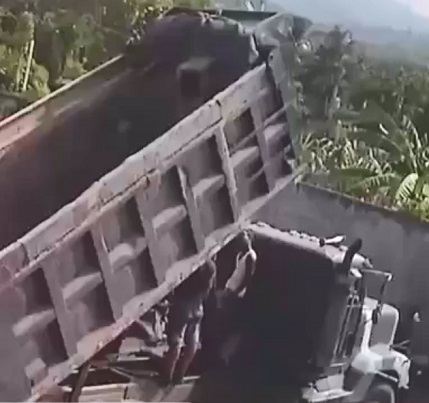 Standing Under a Raised Bed of a Dump Truck Goes Wrong