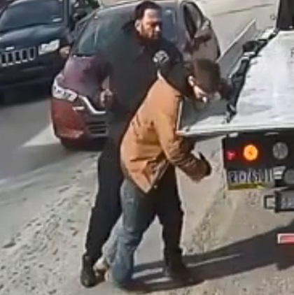 Shocking Video Shows Violent Punch that Drops Tow Truck Driver