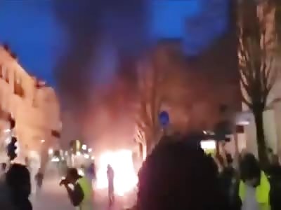 Protestor pays price for picking up a smoke grenade