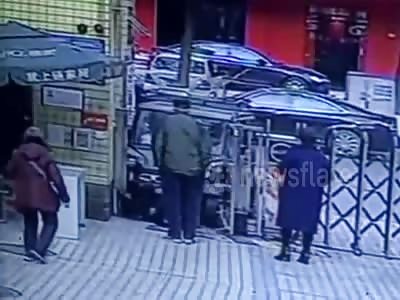 Car crashes into security guard...