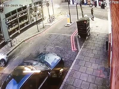 Man runs in terror as he is almost crushed by collapsing building