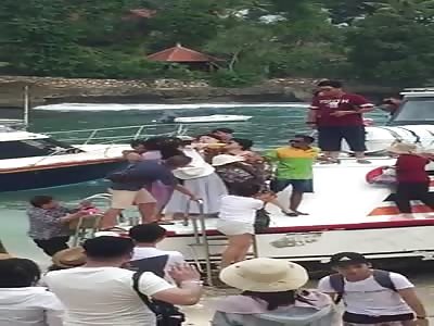 Two old ladies fight on speedboat as they race to be first to the beac