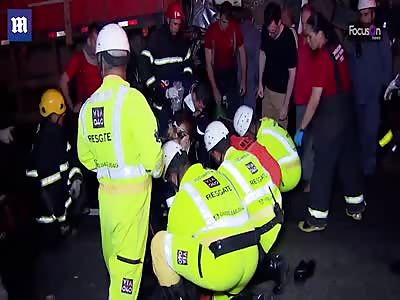 Motorist found alive, after being crushed between two trucks