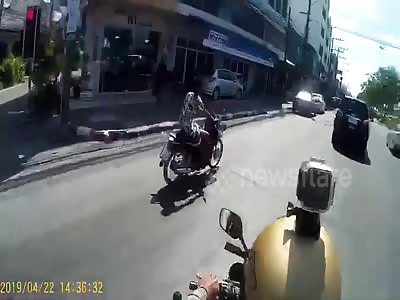 Bungling crook sparks police motorcycle chase but hits and curb....