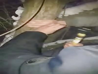 Man nailed to tree by his hands.