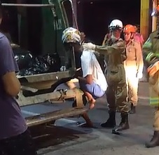 Biker Becomes One with Garbage Truck