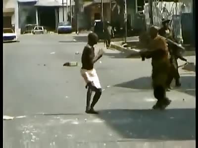 Crying African Man Gets His Head Blown Open