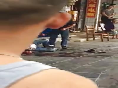 man beats another with stick