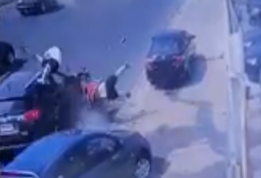 Lady Texting While Driving Slams Into Two Bystanders