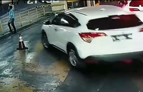 Parking Garage Attendent Crushed Against Wall