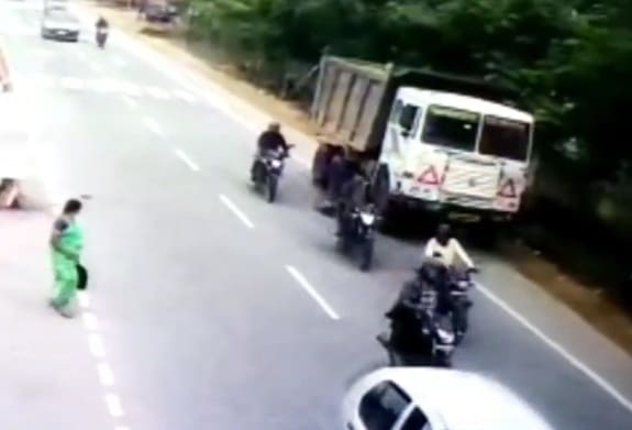 Lady in Green Fails at Crossing the Road