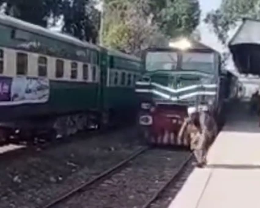 Old Man Oblivious To Oncoming Train 