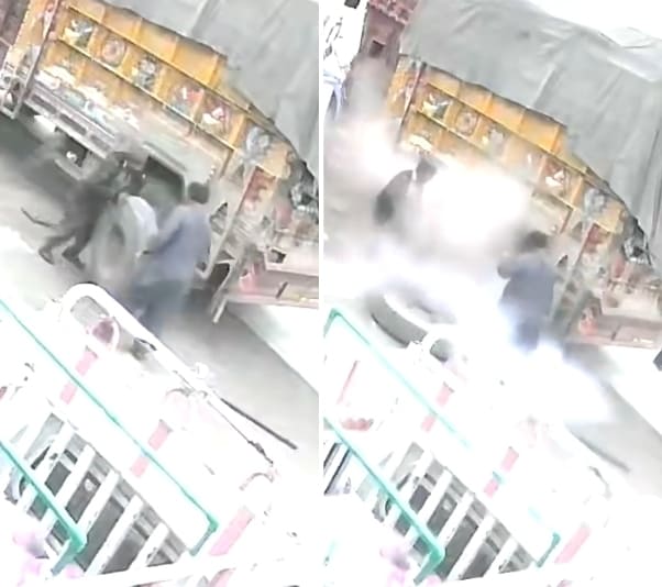 Close Call: Tire Explodes On Mechanics