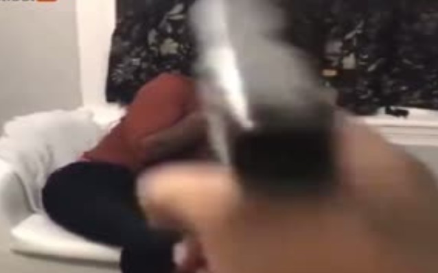 Moron Points Gun at his Girl it Accidentally Goes off