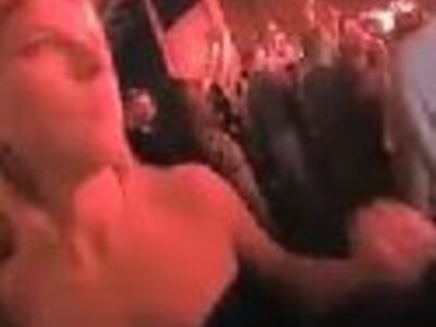 Blonde slut gives handjob at rock concert