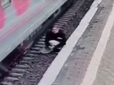 Student lies on Tracks taking off her Head (New)