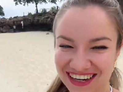 Ukrainian woman on vacation in Africa. She seems very Happy