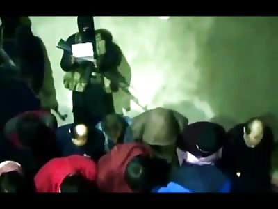 Brutal New Execution shows Man Taken from Group and Killed with a Bullet to the Back of the Head..