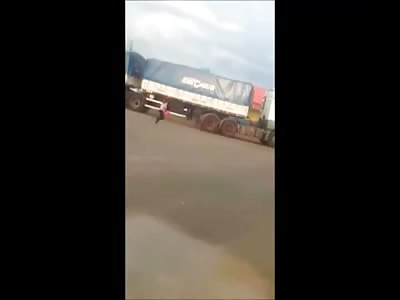 Woman in Pink Decides to end it All by Falling Underneath the Wheel of a Big Rig Truck 