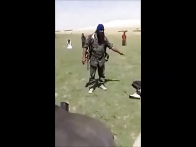 Man that Looks like a Biker or a Member of ZZ Top Organizes a Brutal Firing Squad Exectuion