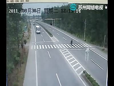 Suicide or Stupidity? Biker Crosses Lanes to Get in the Way of a Bus 