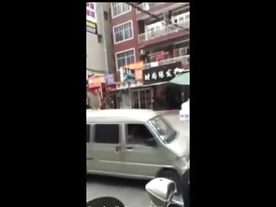 Crazy Naked Asian Girl with a Pretty Nice Body Goes Berserk on the Street Trashing Everything She Can