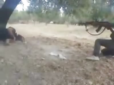 Syrian Rebles Use Human Bodies for Target Practice