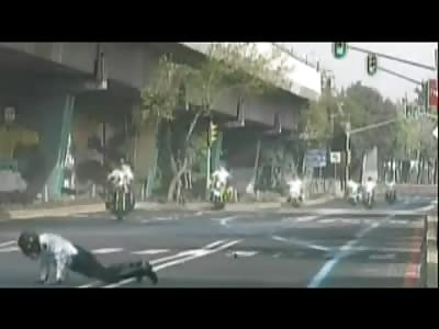 Police Motorcyclist forgets about the Speed Bump (Whoops) 