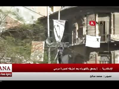 Moronic Protester in Egypt Pulls a Morsi Flag down and Gets Electrocuted by Powerlines 