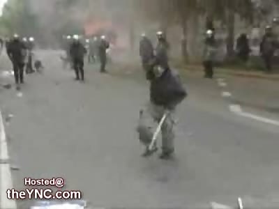 Kid throwing Rocks at the Police gets Shot in the Back