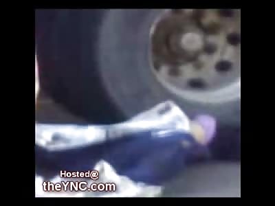 19 Year Old Girl with an Industrial Truck sitting on her Torso