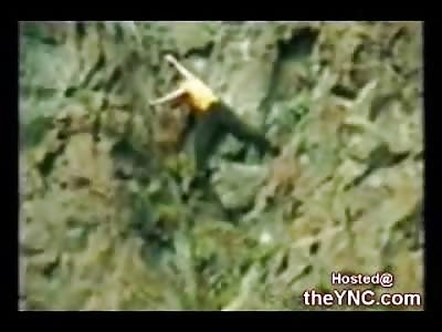 Man climbing a Large Cliff falls to his Death