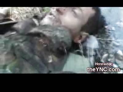 Dead Georgian Soldier lies Alone in a River