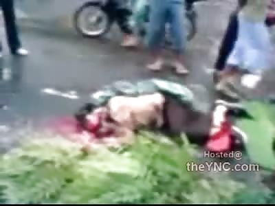 Trying to Cover the Dead Guy with Tree Leaves