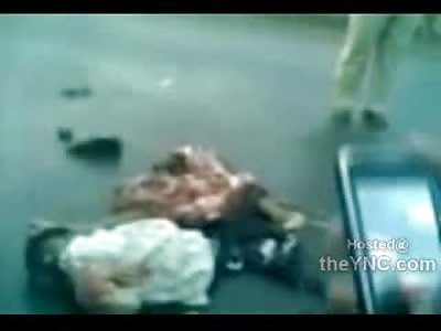 Man Ripped in Half,  Guts Loaded onto Blue Tarp Piece by Piece