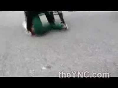 Ghetto Fight Leaves Shirt and Weave Scattered on the Road