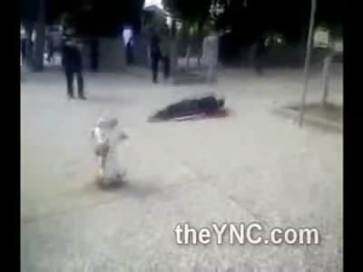 Black Man Shot by Police Dying on the Sidewalk as Angry Crowd gathers around Officers