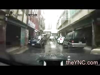 Epic Maniac nearly Kills Man on his Hood who is Attacking Him with a Baseball Bat