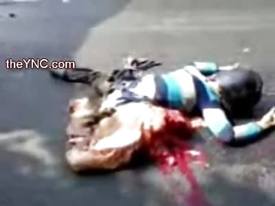 Female Biker has Hands Up and Lower Half Ripped Apart from her Torso