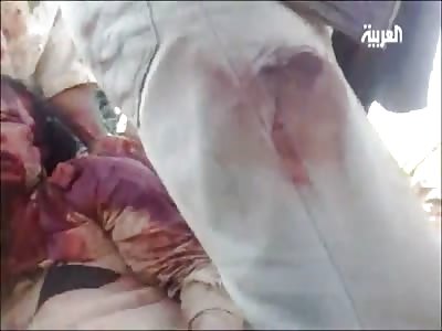 Gaddafi Filmed Being Thrown in the Back of a Truck...Dead as a Doornail