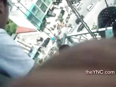 Rescue Workers on a Scaffold pull Suicidal Female from High Ledge