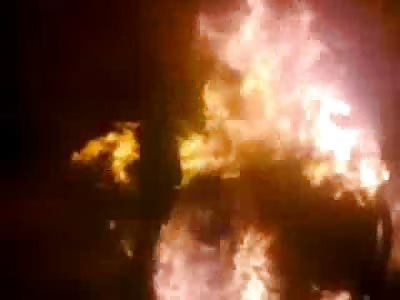 Man Burns atop a Car after Rocket Attack in Syria