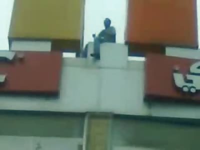 Crazy Muslim wants to Jump from the KFC Sign 